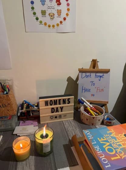 Workshop table with art supplies and candles